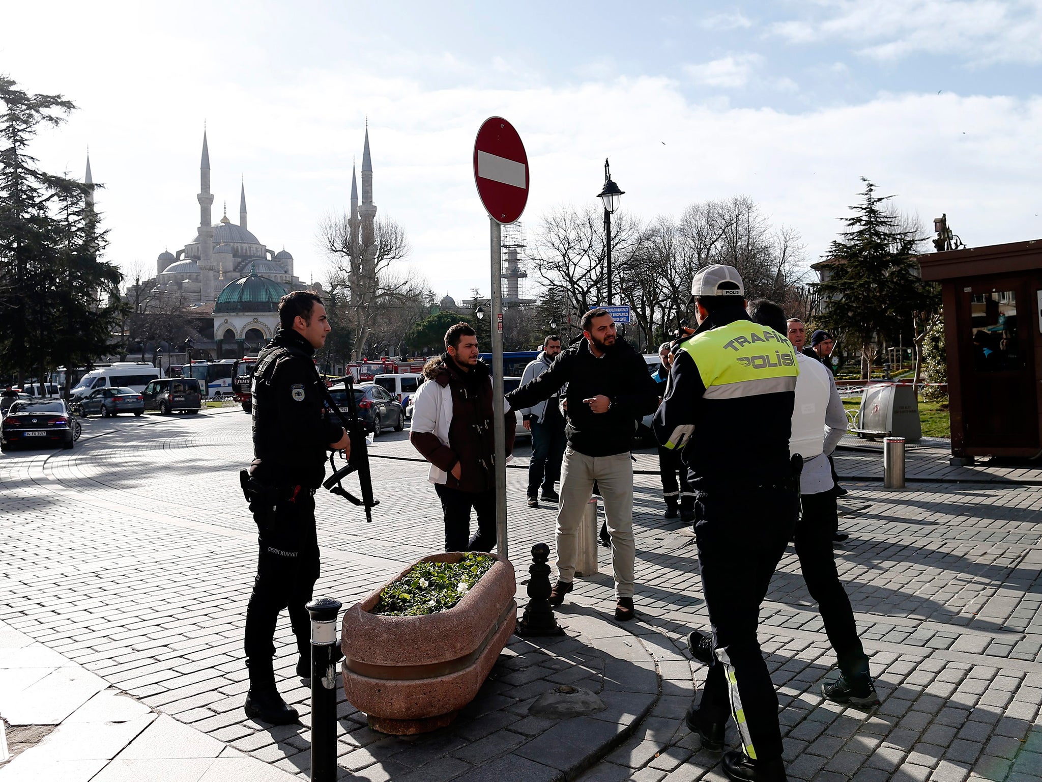 Policemen secure the area after the explosion near the Blue Mosque in the Sultanahmet district of Istanbul