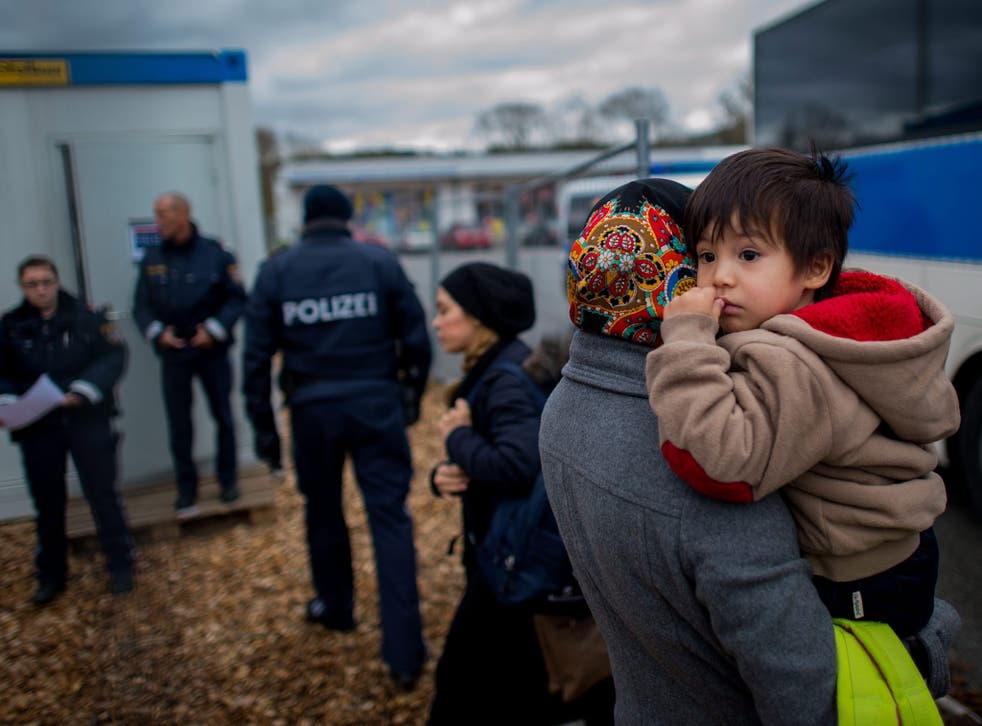Migrants arrive at a temporary camp after German officials sent them back to Austria in Schaerding Am Inn, Austria, 12 January 2016.