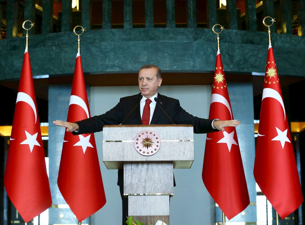Turkey's President Tayyip Erdogan addresses the audience during a meeting in Ankara, Turkey
