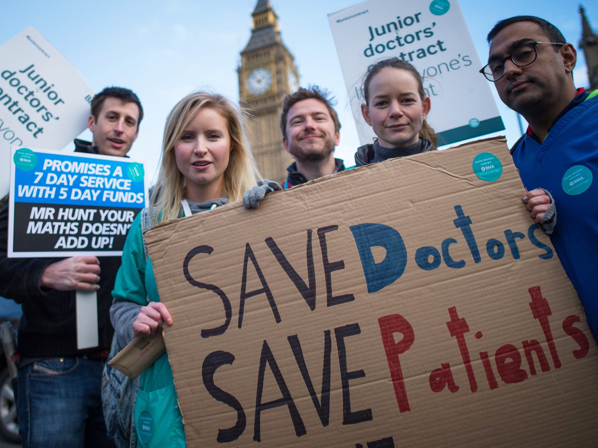 Junior doctors and medical students demonstrate outside the Houses of Parliament in London as part of a nationwide one day strike in a dispute with the government over new contracts