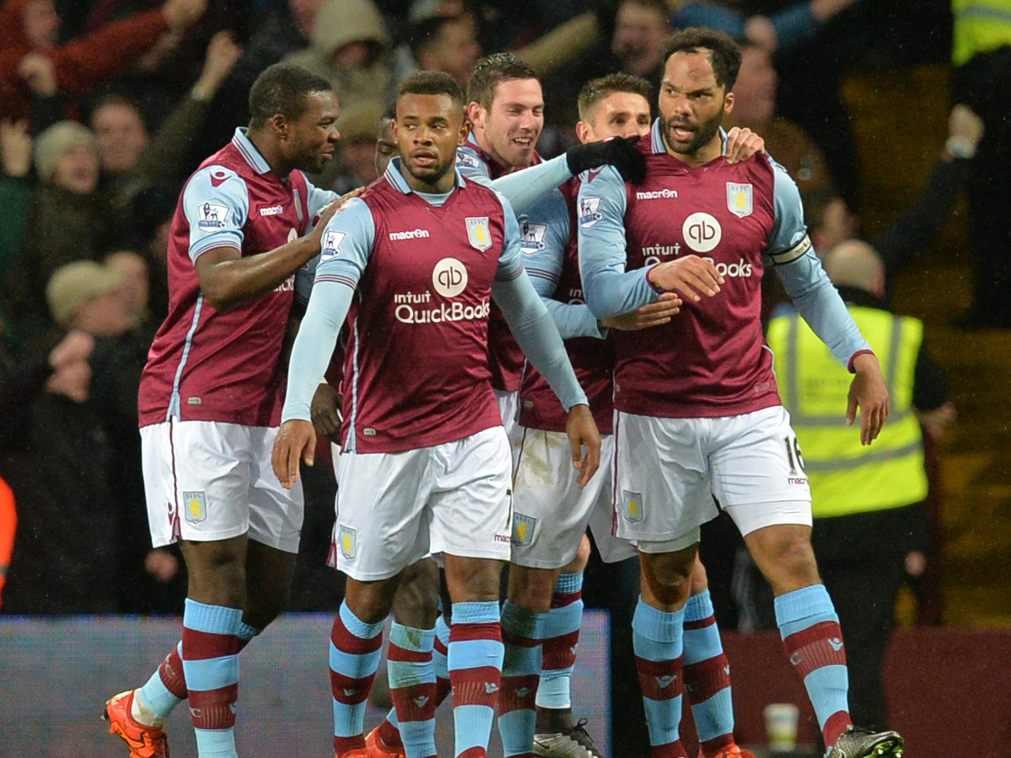Aston Villa's players congratulate Joleon Lescott on his goal
