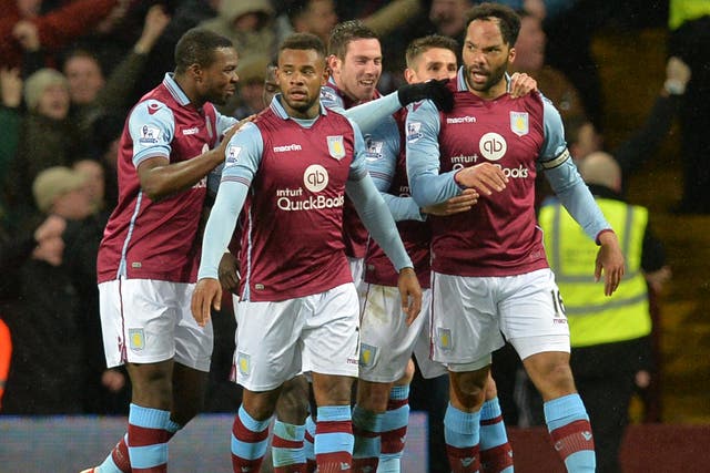 Aston Villa's players congratulate Joleon Lescott on his goal