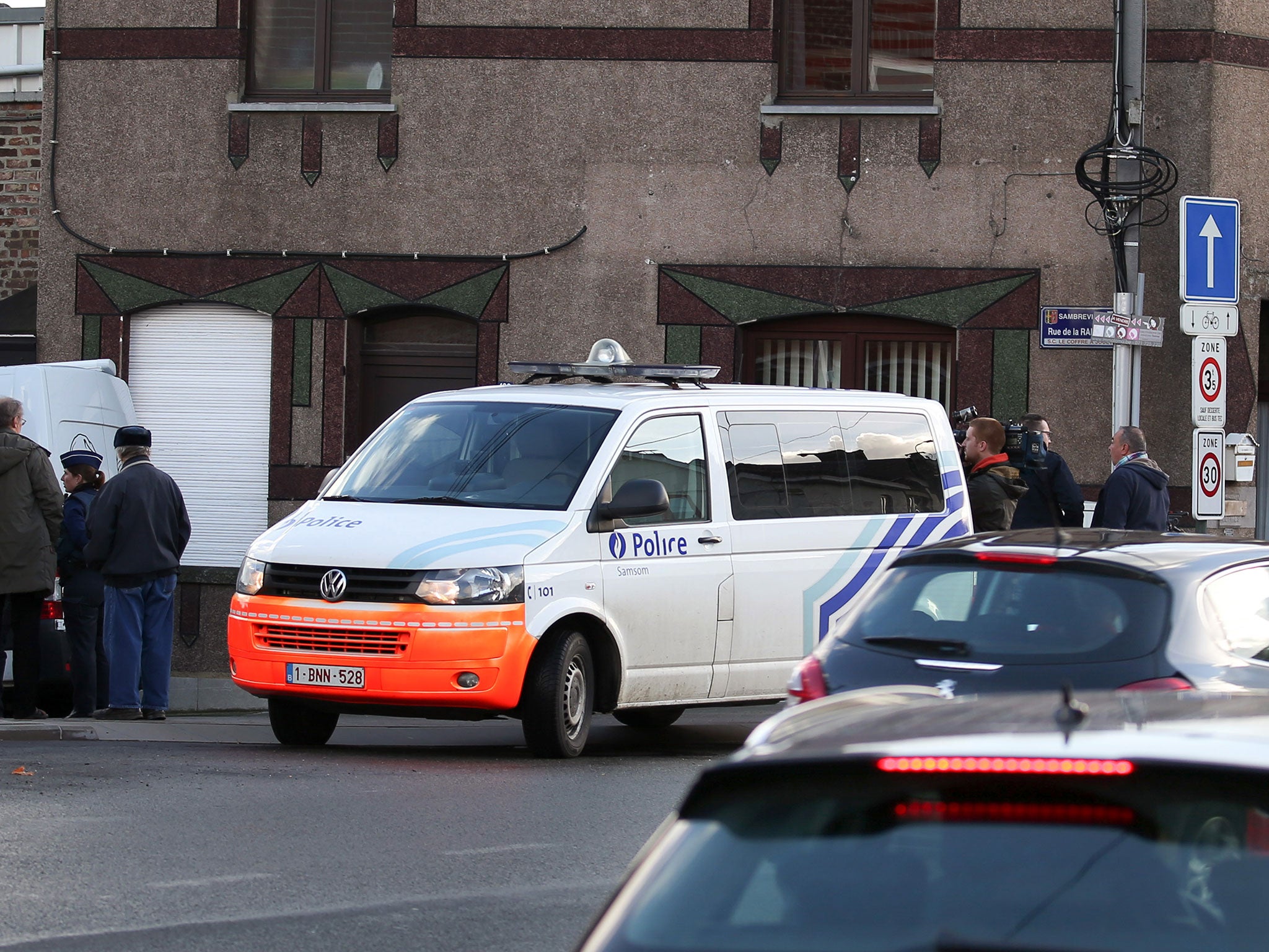 A police van is parked during a police intervention in Auvelais, on November 26, 2015.