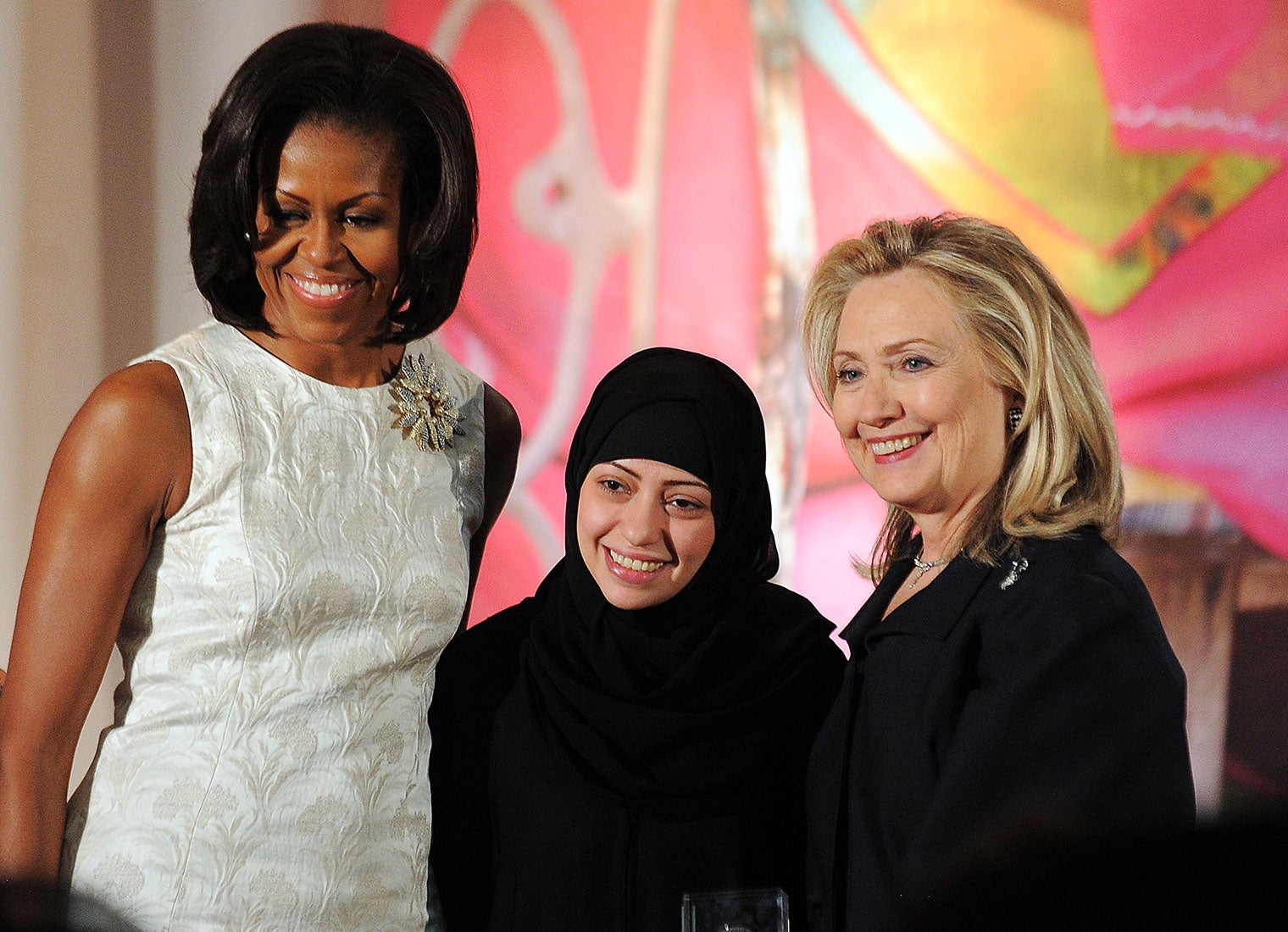 Samar Badawi receives the 2012 International Women of Courage Award from Michelle Obama and Hillary Clinton