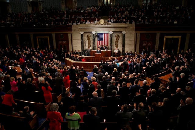U.S. President Barack Obama gets a standing ovation from both sides of the aisle at the conclusion of his final State of the Union address to a joint session of Congress in Washington
