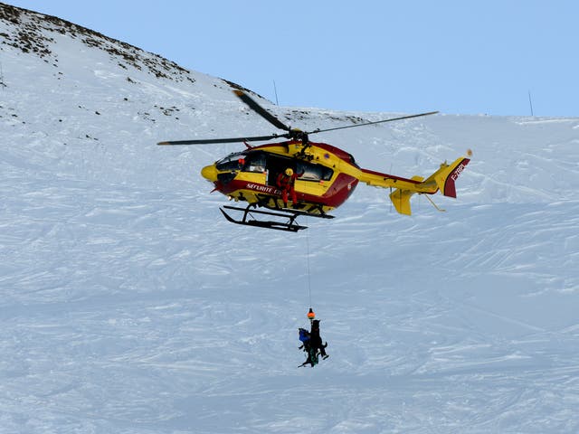 A helicopter is seen during a mock avalanche drill, on December 11, 2013 near Les Deux Alpes ski resort, French Alps.