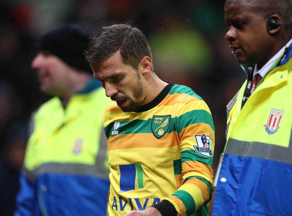Norwich City midfielder Gary O'Neil walks off the pitch after receiving a red card