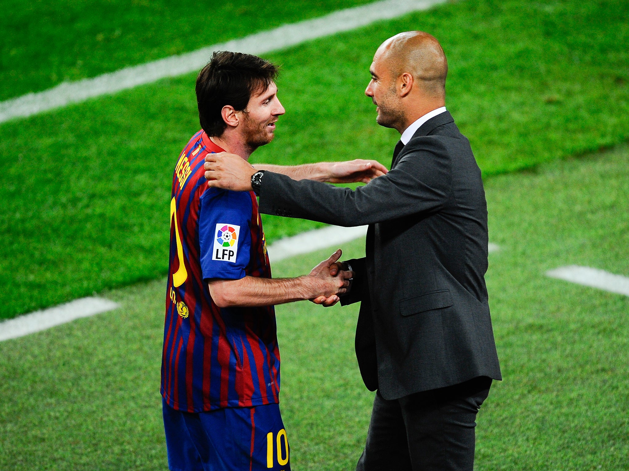 Lionel Messi greets Pep Guardiola in 2012