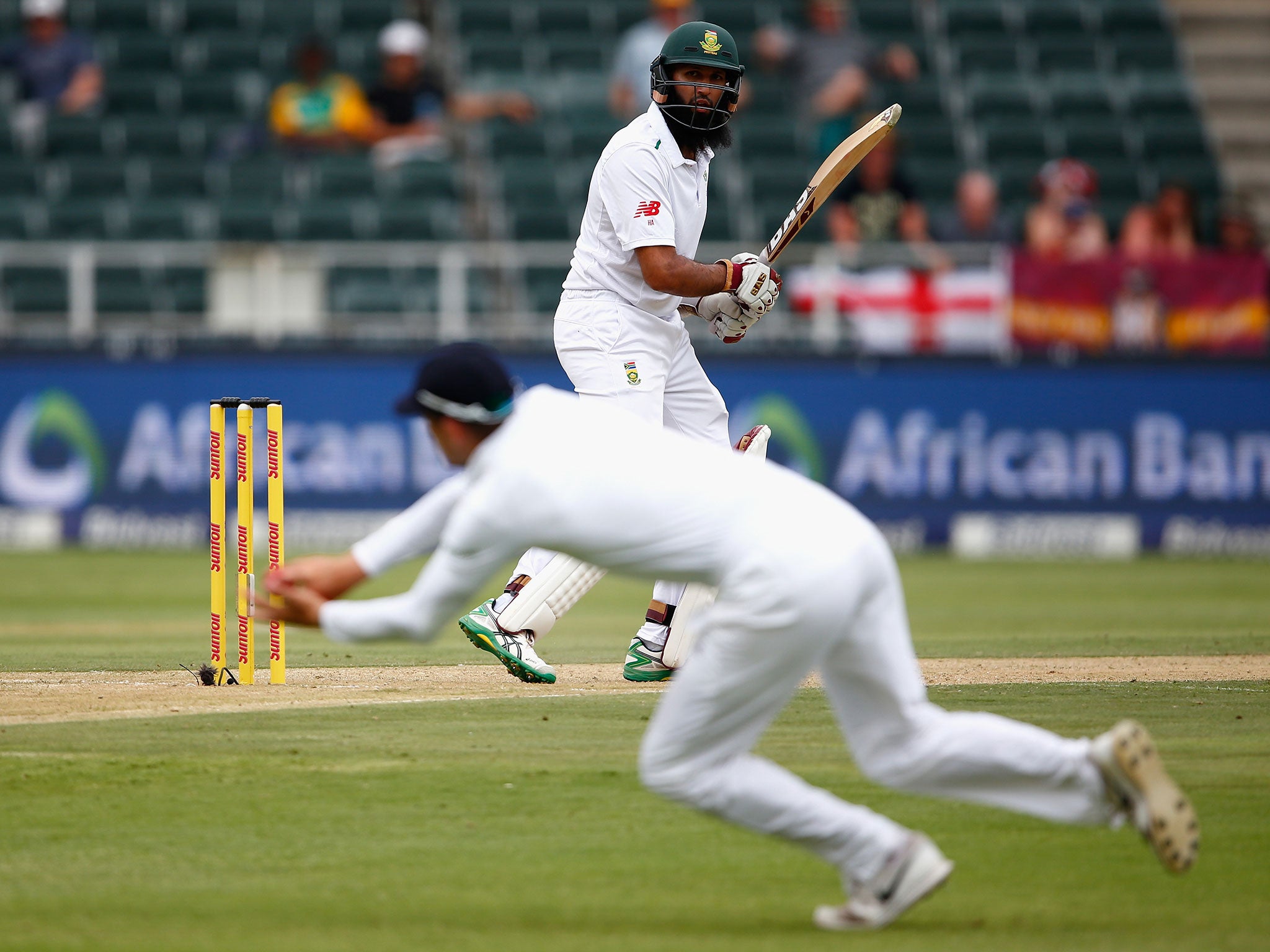 Hasim Amla watches Alex Hales stop the ball from going beyond the slip cordon