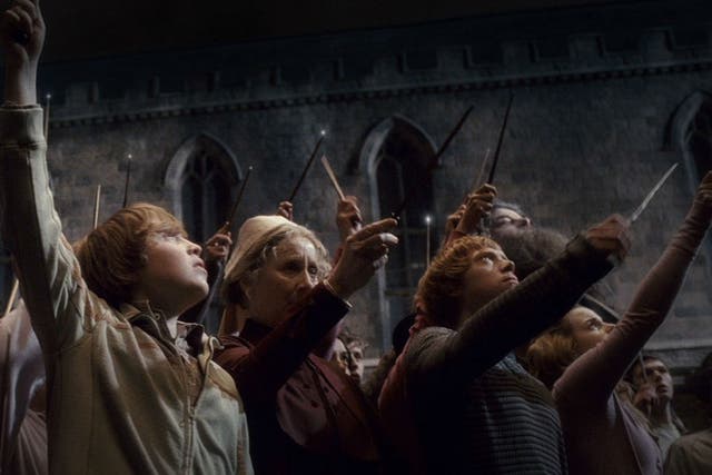 Harry Potter students raise their wands after the death of Albus Dumbledore