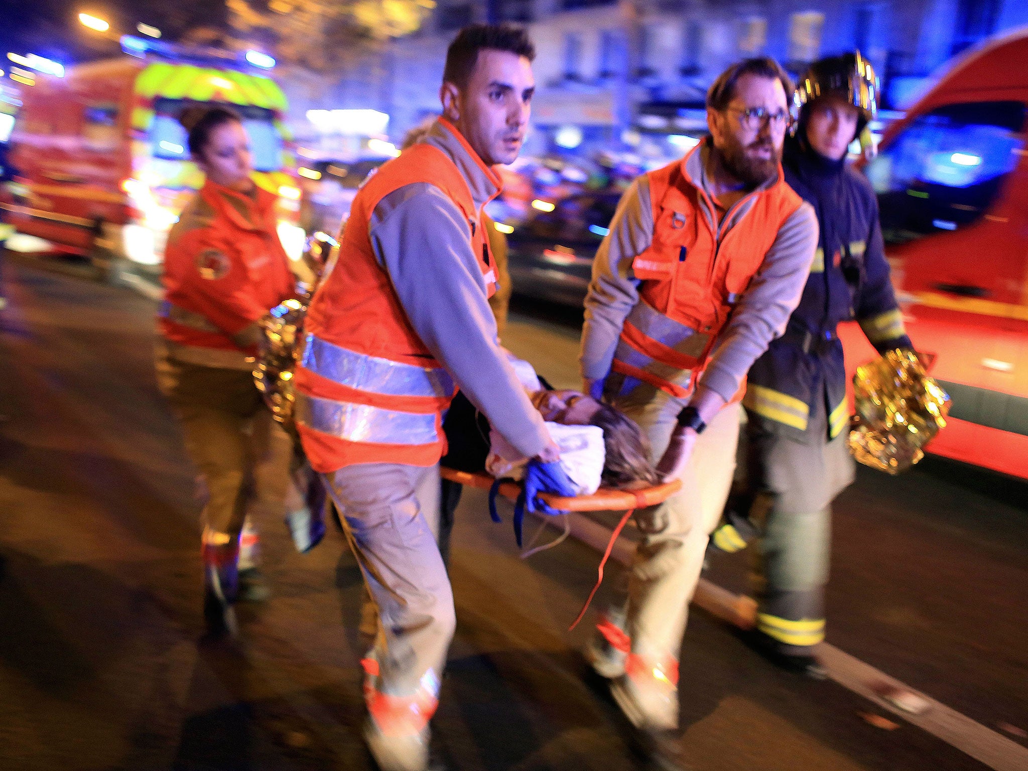 Terror threat: An injured woman is taken from the Bataclan Theatre after the shootings in Paris on 13 November last year
