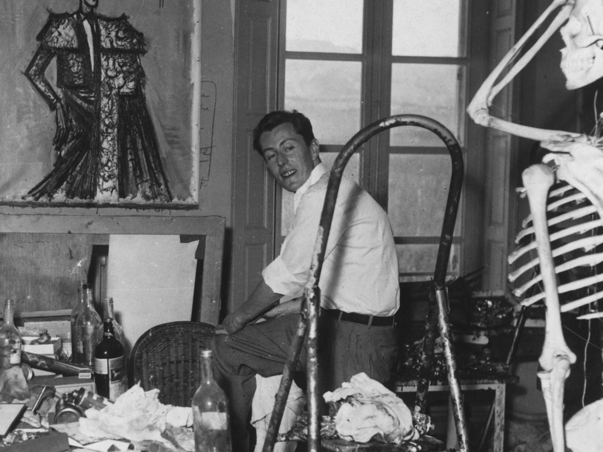 Bohemian cool: the painter Bernard Buffet, one of the best-paid artists in France, at home in his studio in an old chateau in Provence in 1958