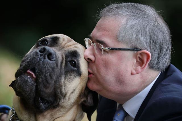 Barrister Geoffrey Cox, with his dog George, hoped to reclaim £4.99 for weedkiller