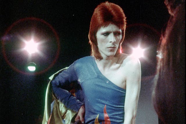 David Bowie performs onstage during his "Ziggy Stardust" era in 1973 in Los Angeles, California