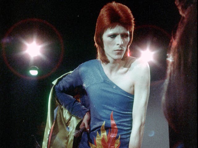 David Bowie performs onstage during his 'Ziggy Stardust' era in 1973 in Los Angeles, California
