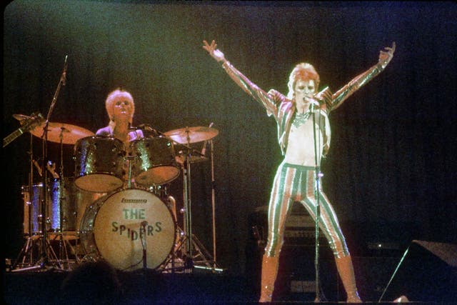David Bowie performs onstage during his "Ziggy Stardust" era in 1973 in Los Angeles