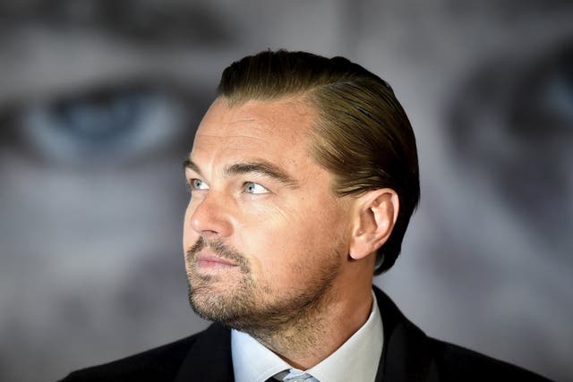 Actor Leonardo DiCaprio poses as he arrives for the British premiere of "The Revenant", in London