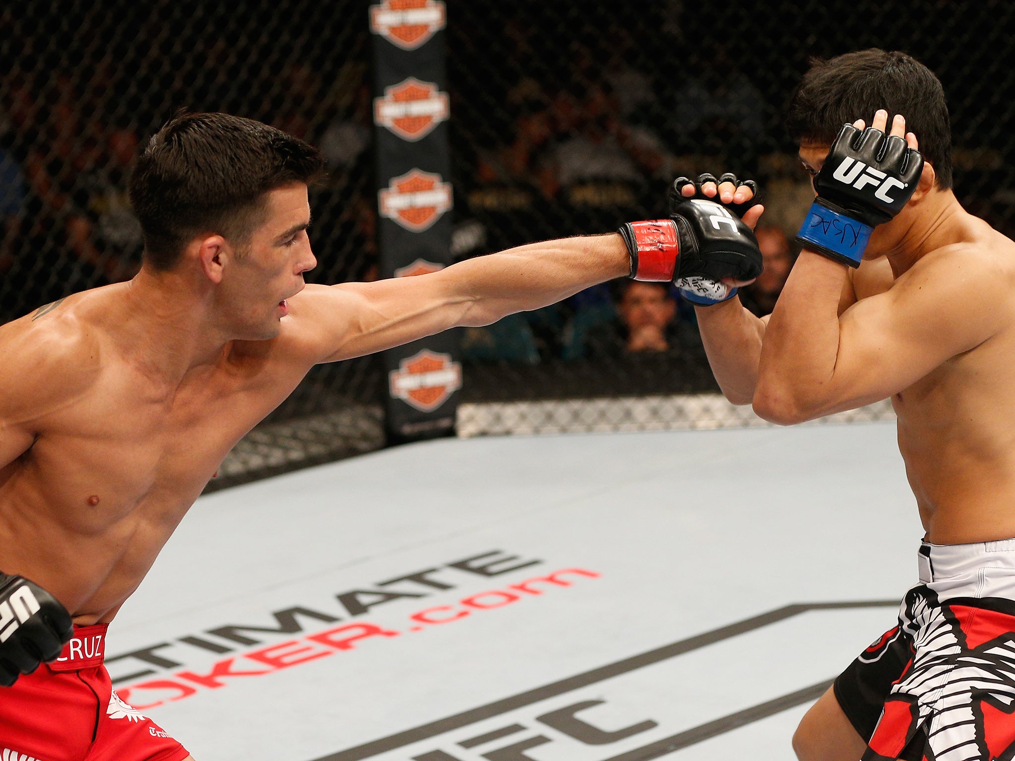 Dominick Cruz attempts to hit Takeya Mizugaki