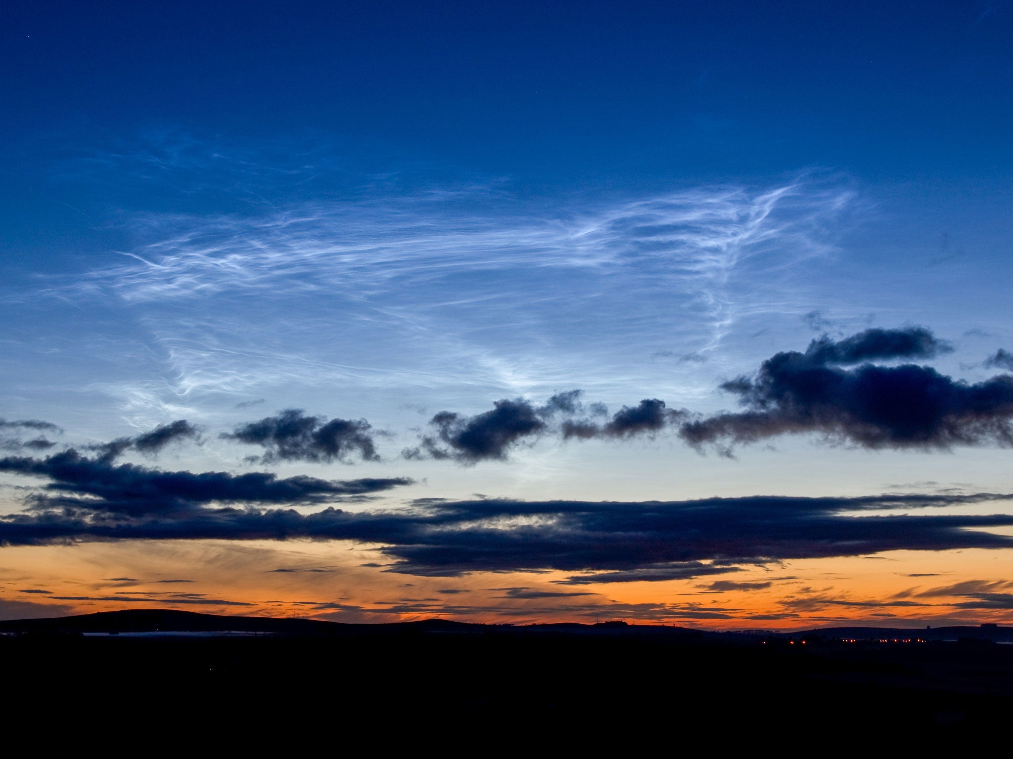 Noctilucent clouds - the highest in the atmosphere at 50 miles above the Earth - over northern Scotland
