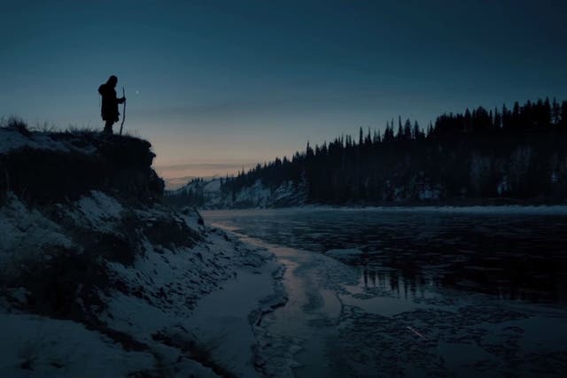 Leonardo DiCaprio stands atop a mountain in front of Emmanuel Lubezki's camera in The Revenant
