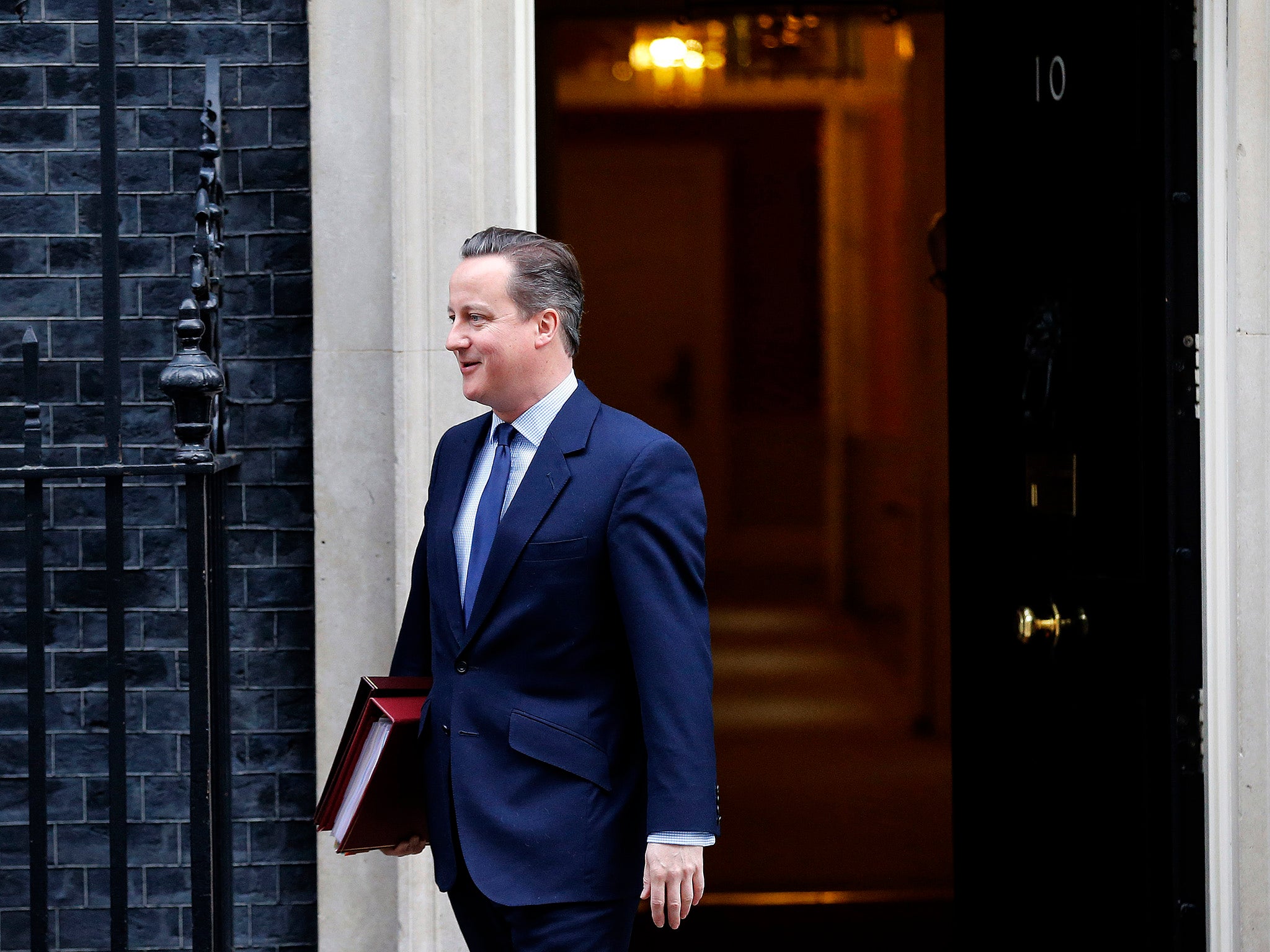 David Cameron leaves No 10 Downing Street to attend PMQs at the parliament in London