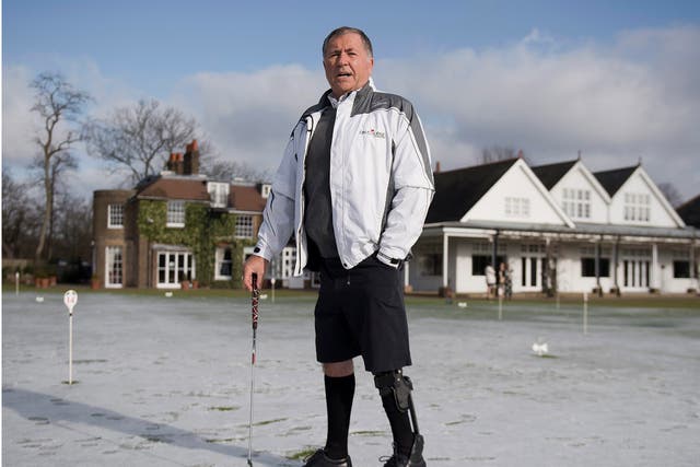 John Simpson wears the world's first lower-limb bionic exo-skeleton, at Royal Wimbledon Golf Course, London, Britain,