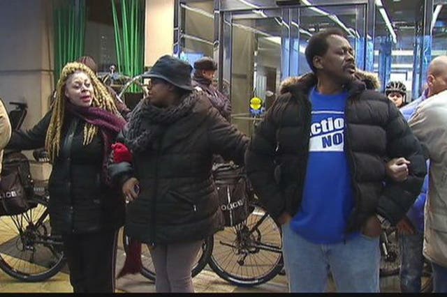 Protestors gather at the Martin Luther King breakfast and call for the Mayor to step down