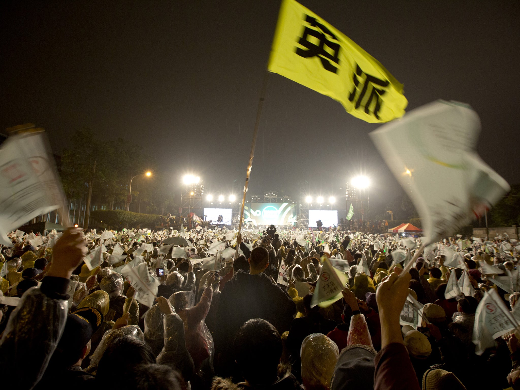 A flag with "Ing Clique" sign on flies in the sky during a rally in Taipei, Taiwan. Tsai Ing-wen, leader of the Democratic Progressive Party, leads in most polls ahead of Saturday's election in the island of 23 million people.