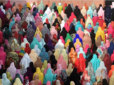Pakistani Muslims offer Eid al-Adha prayers at the Badshahi Mosque in Lahore