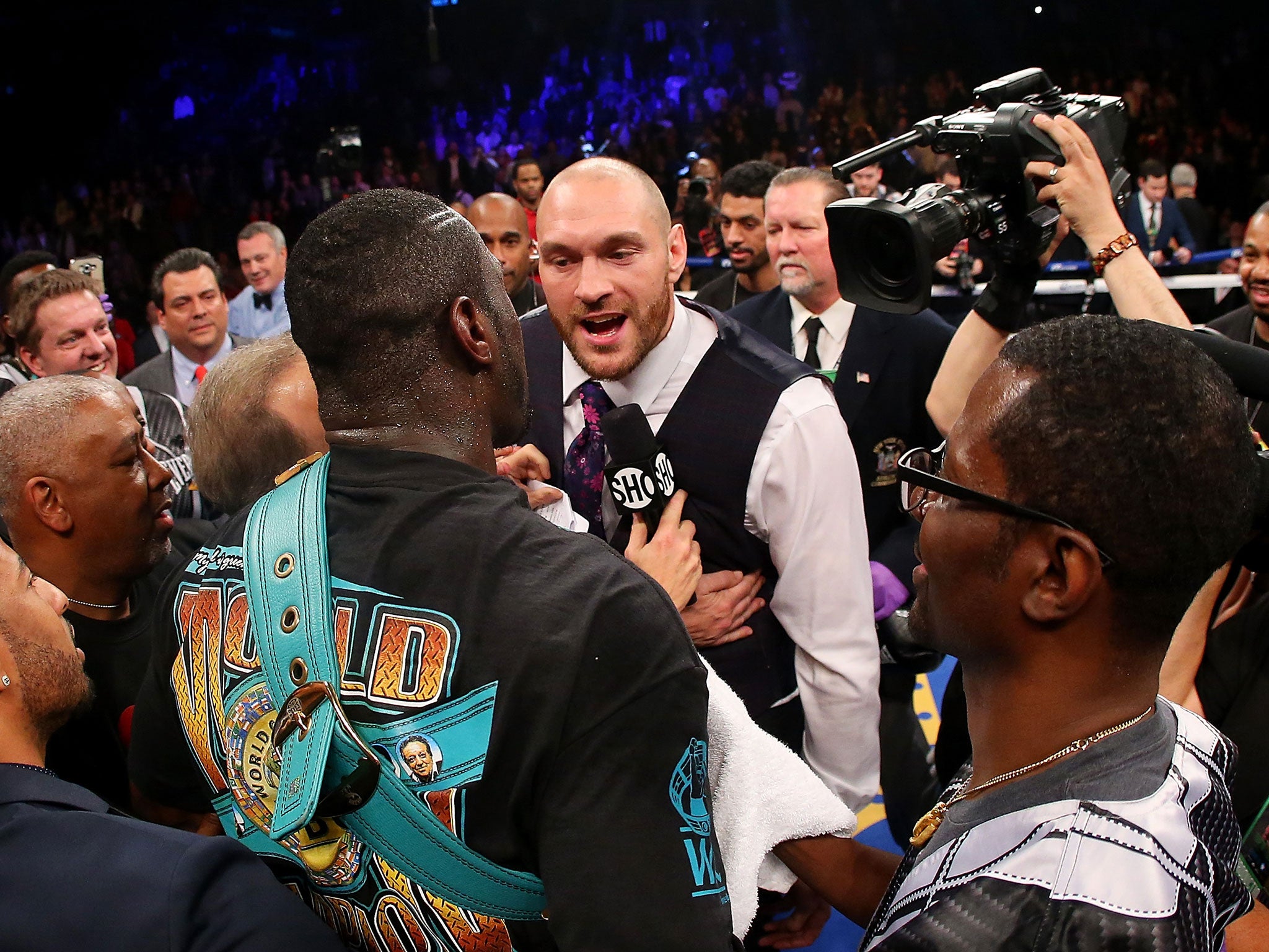 Heavyweight champions Deontay Wilder and Tyson Fury exchange words