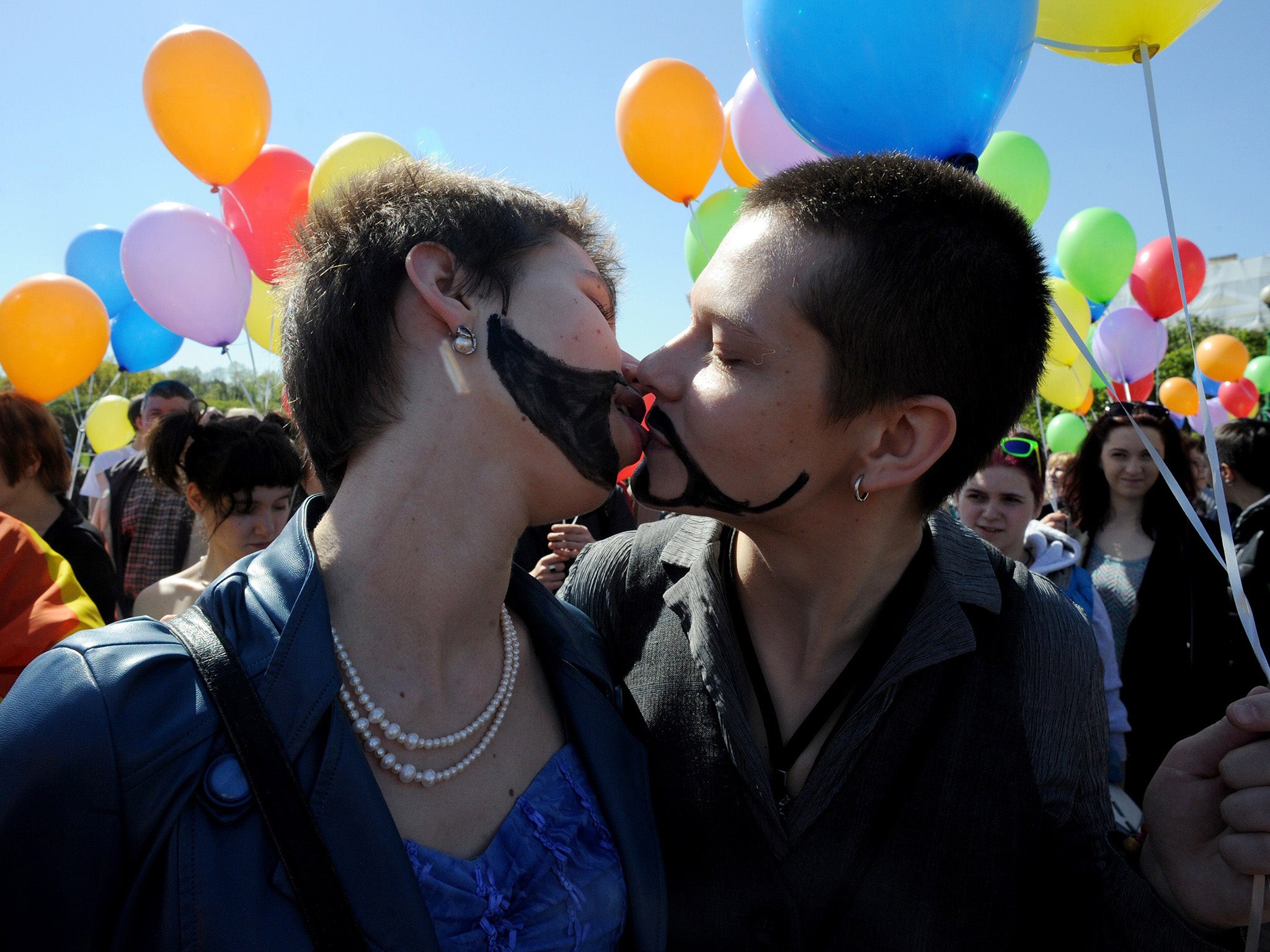 LGBT protesters at a demonstration in St Petersburg. Gay couples could face a fine or two weeks in prison if the legislation is passed