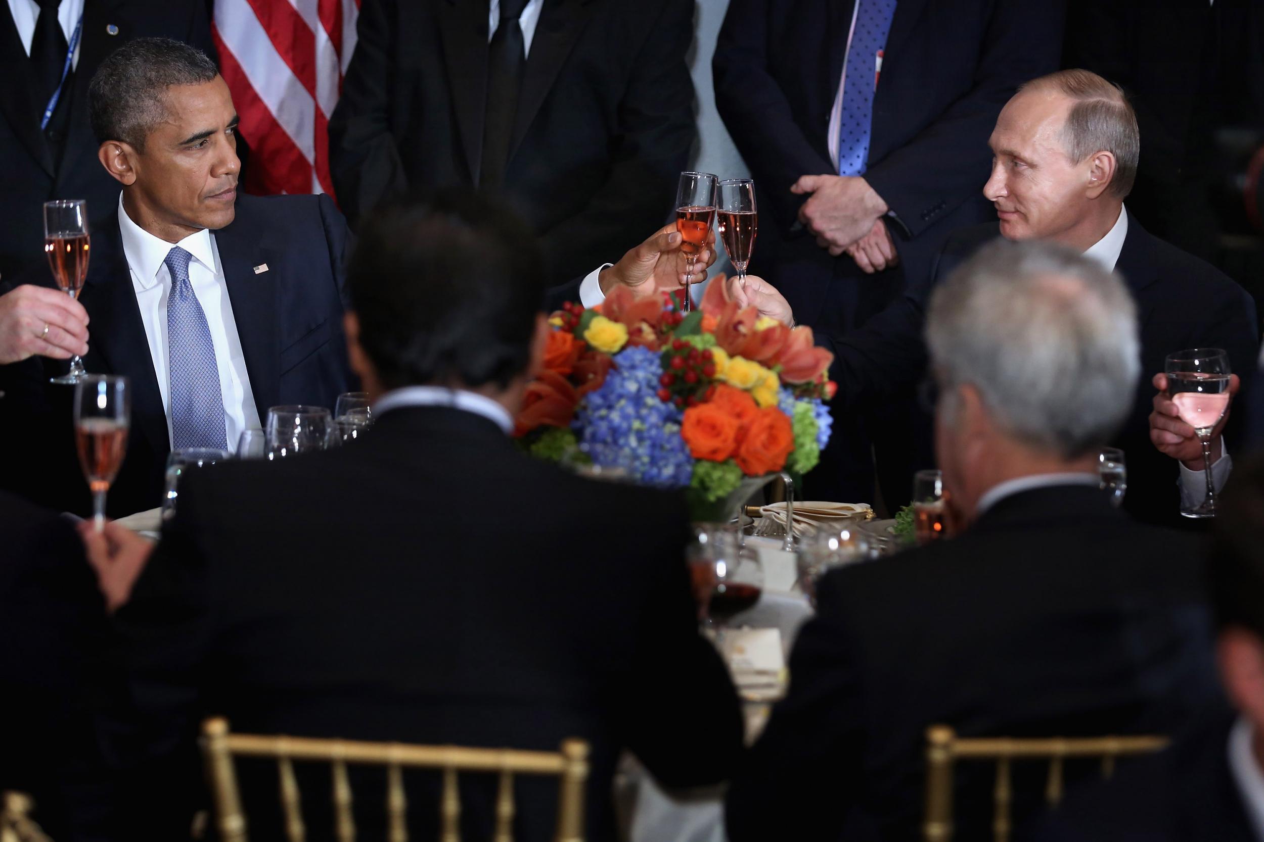 Presidents Barack Obama and Vladimir Putin toast at a UN General Assembly luncheon in September 2015