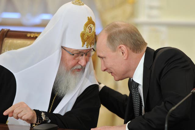 Patriarch Kirill, pictured with Russian President Vladimir Putin, claimed he was not surprised that 'honest' Muslims are flocking to Isis' quasi-religious state