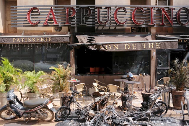 The burned-out exterior of "Cappuccino" restaurant is seen in Ouagadougou, Burkina Faso 