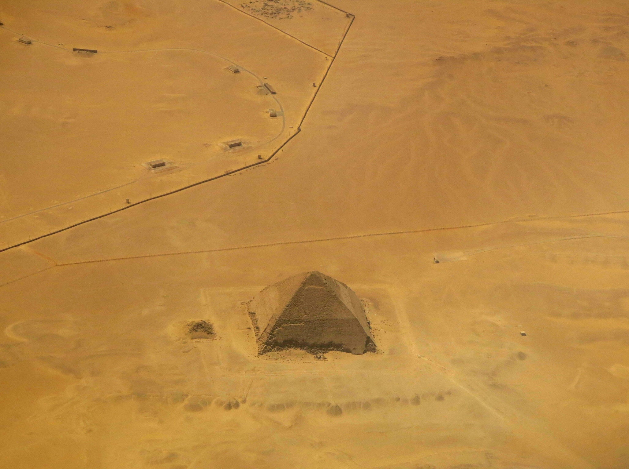 A picture taken on April 19, 2015 shows an aerial view of the bent pyramid of Dahshur, a royal necropolis located in the desert on the west bank of the Nile river, just south of Cairo