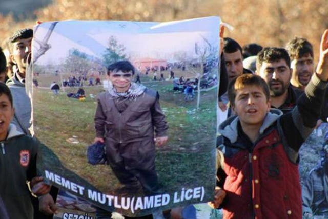 The funeral of 16-year-old Mehmet Mutlu. There are claims that he was shot while his hands were cuffed behind his back