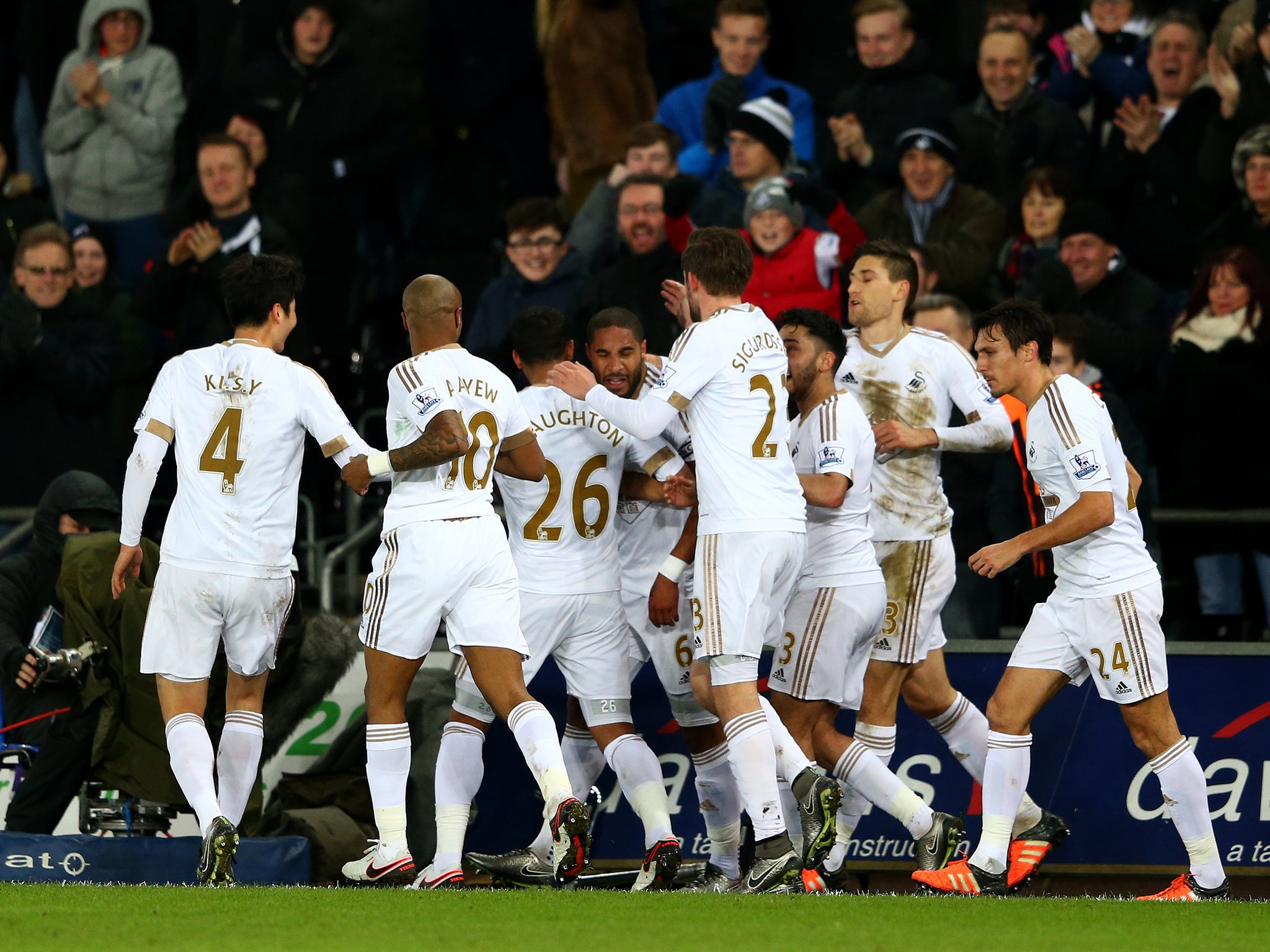 Swansea City celebrate Ashley Williams' opener