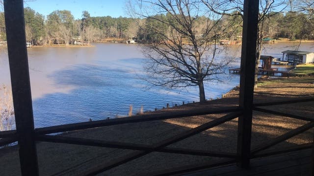 The couple spent the night on the lawn of their home close to this lake
