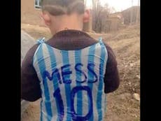 Boy wearing improvised 'Messi 10' carrier bag shirt reportedly found