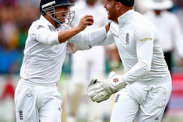 James Taylor (left) celebrates with Jonny Bairstow after he caught South African batsman Dane Vilas at short leg during the dramatic third day of the third Test at the Wanderers