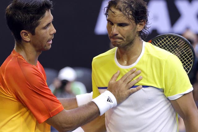 Fernando Verdasco commiserates with Rafa Nadal after his surprise victory over the 14-time Grand Slam winner