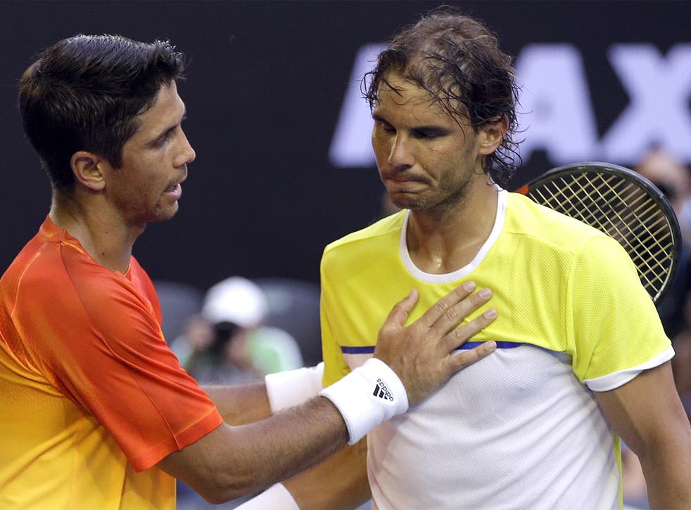 Fernando Verdasco commiserates with Rafa Nadal after his surprise victory over the 14-time Grand Slam winner