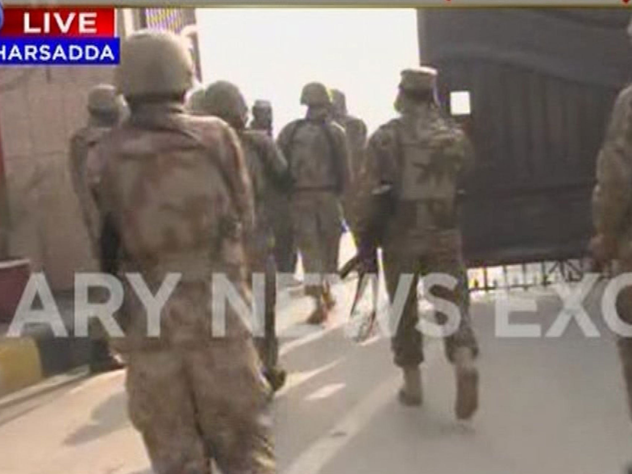 TV footage shows heavily armed soldiers entering the campus