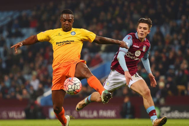 Jack Grealish tries to tackle Wycombe's Anthony Stewart