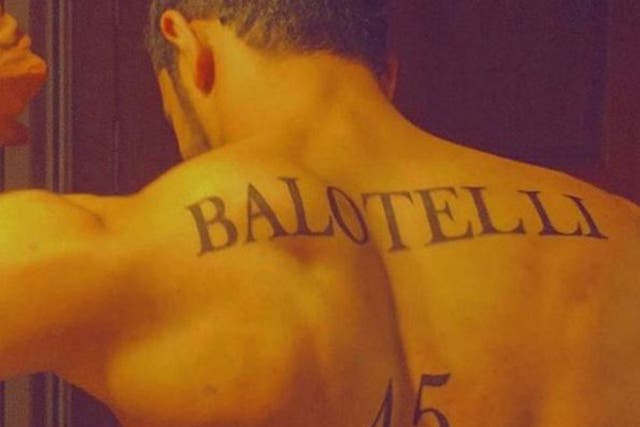 A football fan has had Mario Balotelli's surname tattooed onto his back