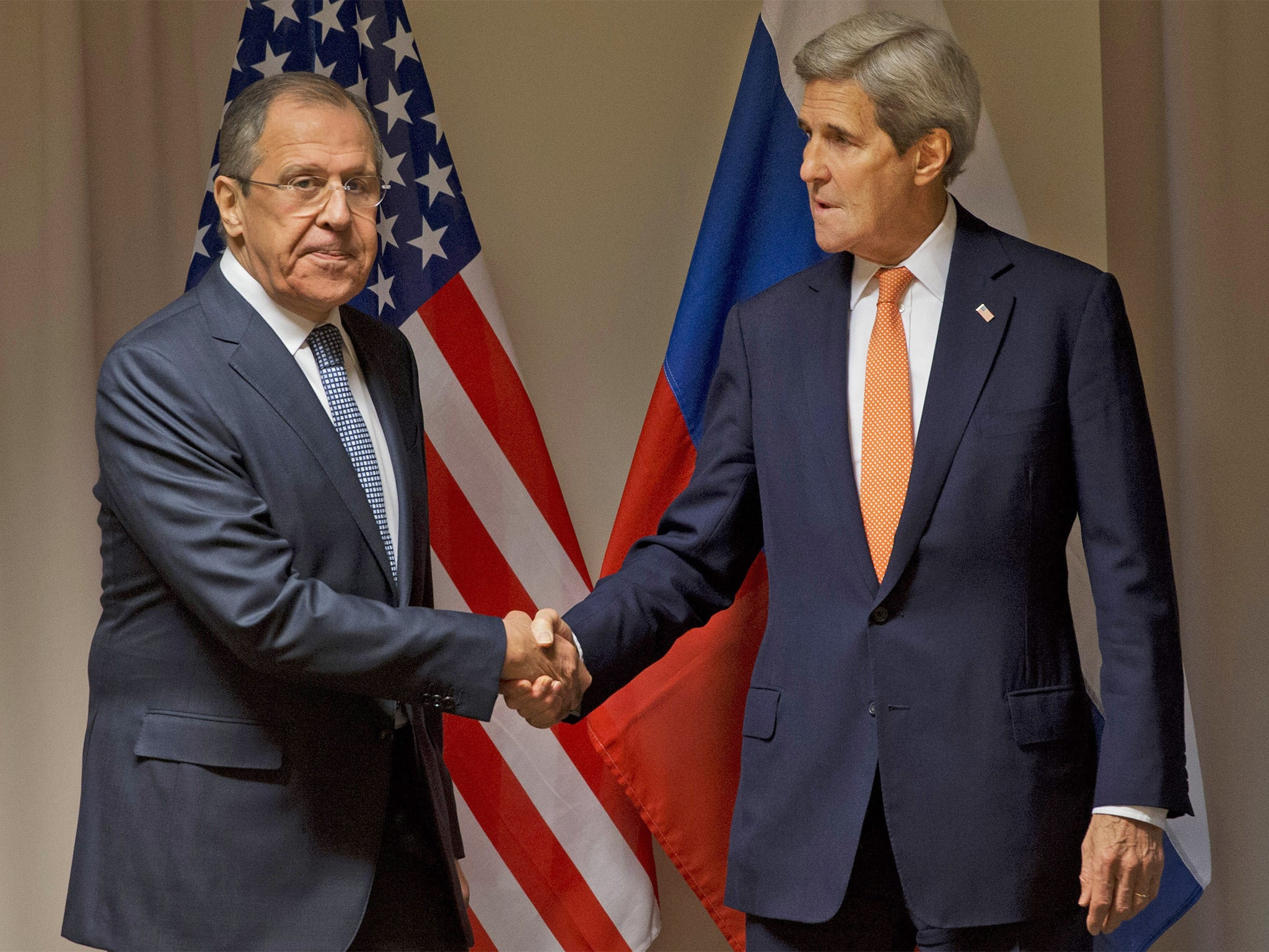 US Secretary of State John Kerry, right, shakes hands with Russian Foreign Minister Sergey Lavrov before their meeting about Syria, in Zurich, Switzerland