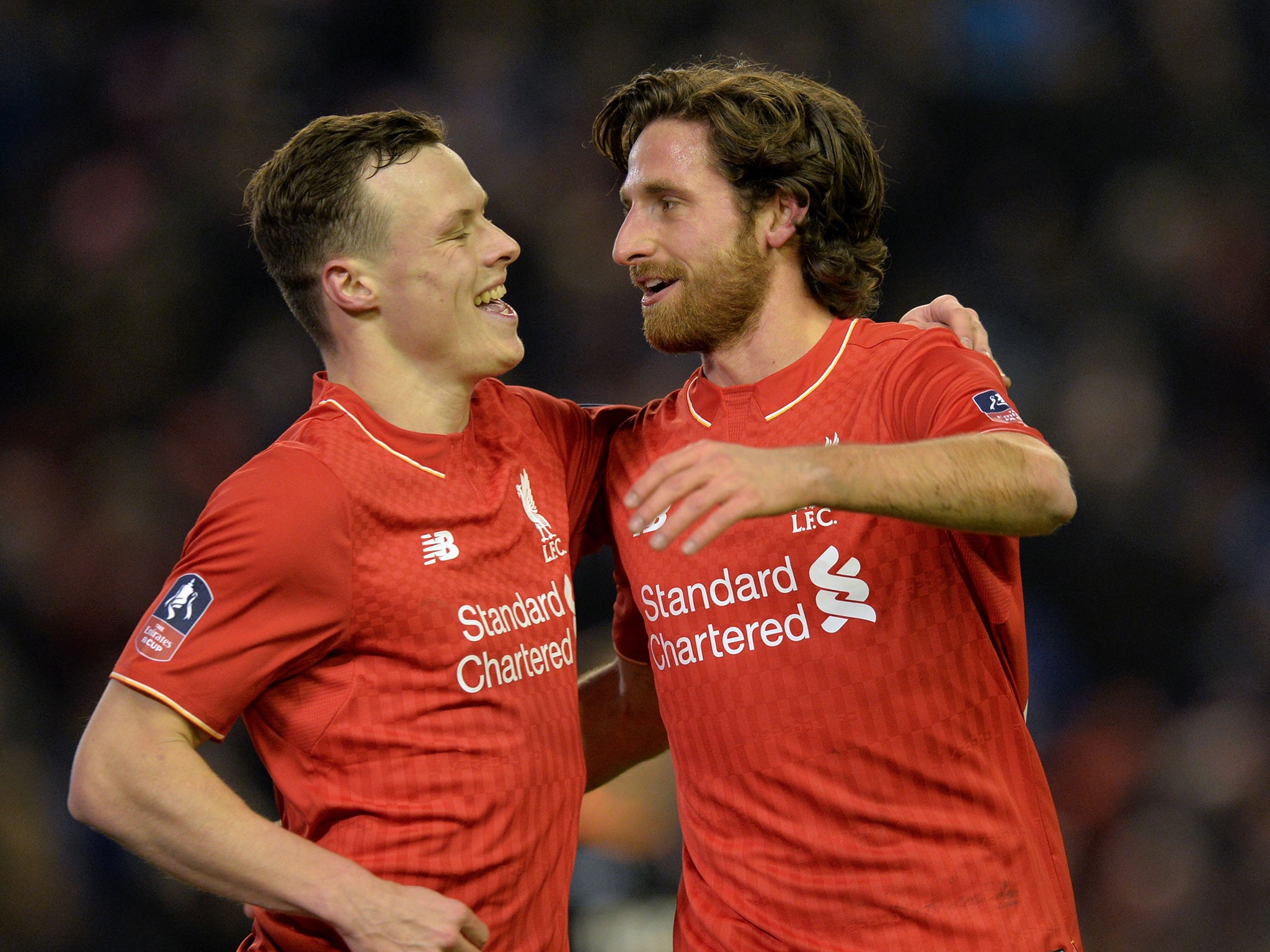 Joe Allen is congratulated on opening the scoring against Exeter City by Brad Smith