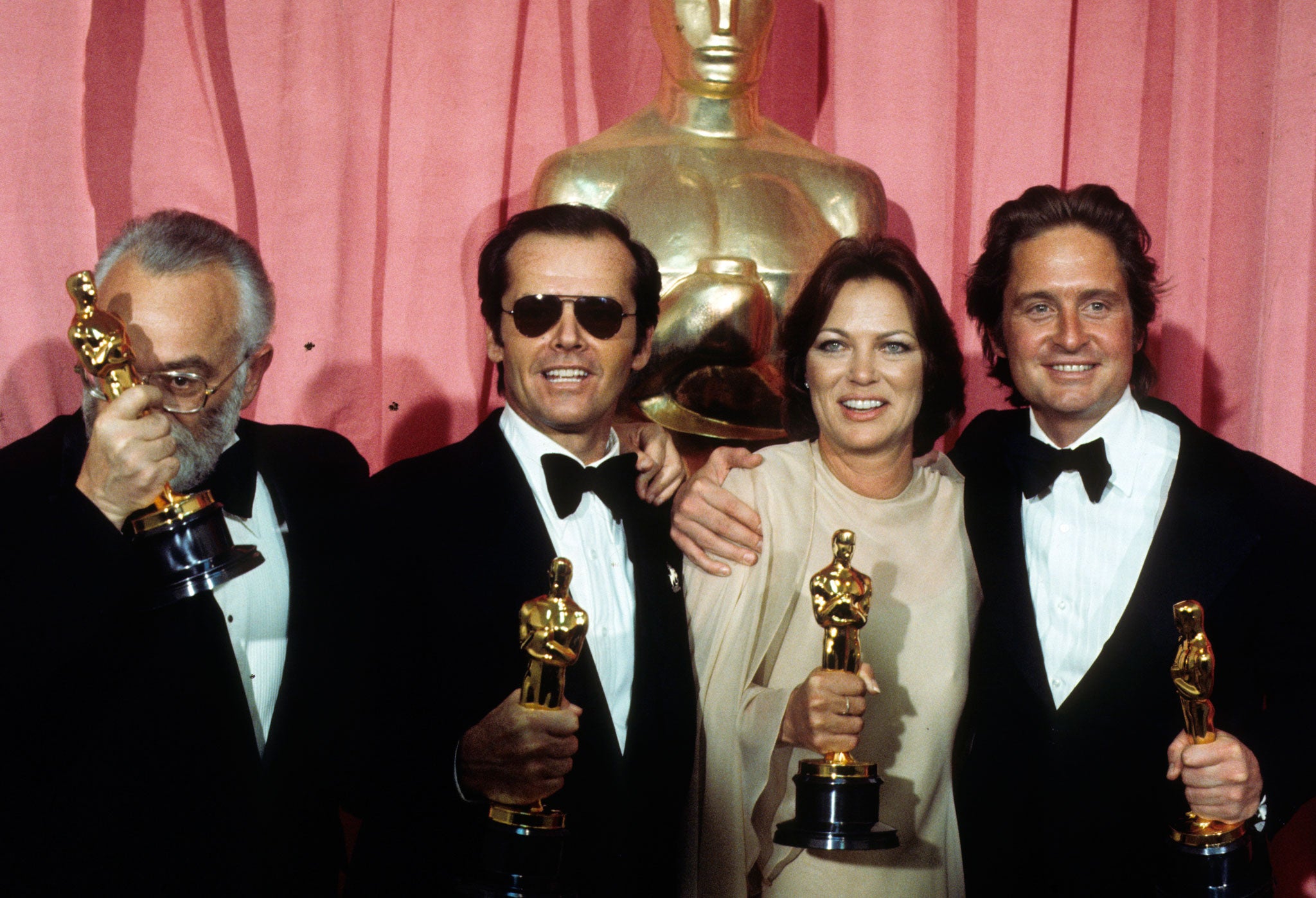 Oscars night, March 1976, flanked by (from left) producer Saul Zaentz, co-star Jack Nicholson, and producer Michael Douglas (Getty)