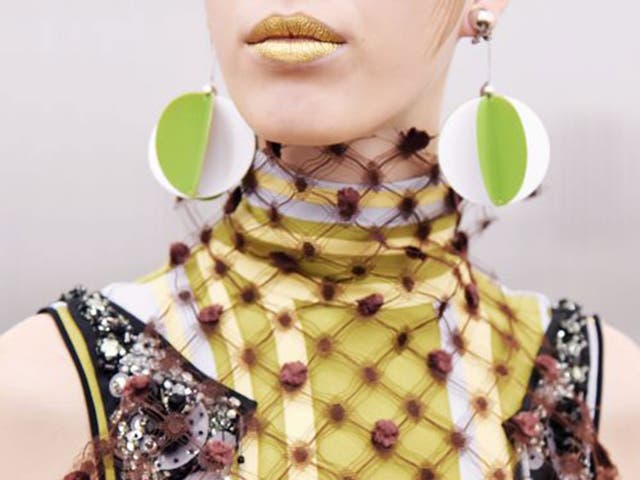 Symbolism: Miuccia Prada opted for over-sized earrings