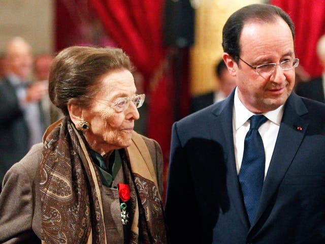Charles-Roux with President Hollande during a ceremony at the Elysée Palace in Paris in 2014